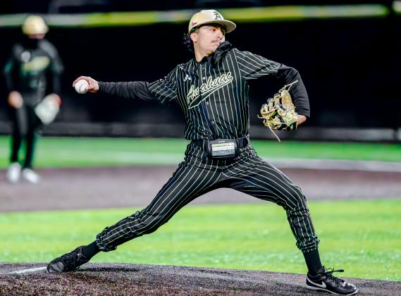 Anahuac’s Oscar Garza delivers a big pitch on Friday against the Baytown Lee Ganders during tournament play. Article Image Alt Text