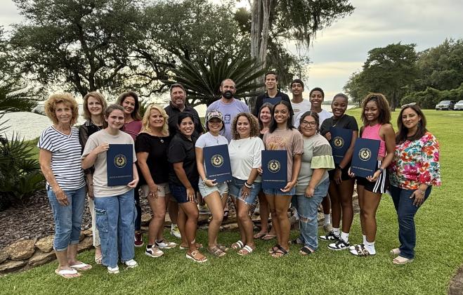 Anahuac Municipal Development District Office Manager Annette Abernathy (back left), House District 23 Rep. Terri Leo Wilson’s Office District Director Susan LeBlanc, Four Corner Tires and Oil owner Lisa Sutch, AMDD Director Sean Perry, Law Office of Lucas Wilson attorney Lucas Wilson, trainee Kennedy Mayer, trainee Zack Delacruz, trainee My’Quiet Davis, trainee Jaylynn Lewis, trainee Bryaneshia Jones, Chambers Liberty Counties Navigation District General Manager Claudia Sandoval, trainee Leah Borne (front left), AMDD Chair Janice Jircik, AMDD Director Monica Rodriguez, trainee Cassi Evans, Anahuac Cleaners owner Sylvia Chavez, Bayside Community Hospital Human Resources Director Terri Billiot, trainee Alyssa Humphrey and Adventure Academy Assistant Director Lydia Lewis join together to celebrate the AMDD Summer Job Training Program and to recognize the trainees for completing the program. Article Image Alt Text
