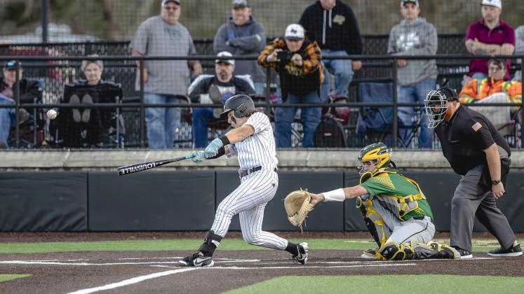 Anahuac’s Blaedin Josephson takes a big swing against the East Chamber Buccaneers in district play. Article Image Alt Text