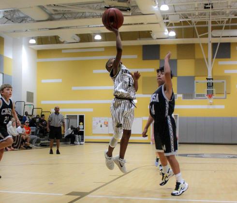 Brendan Williams scores for the J. Williams team, one of the many buckets that contributed to a 41-16 win against CMSA Black. Contributed Photo Article Image Alt Text
