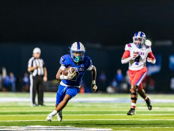 Barbers Hill’s Kaegen Morton has plenty of running room against the West Brook Bruins on Friday night as the Eagles clinched a playoff spot. Article Image Alt Text