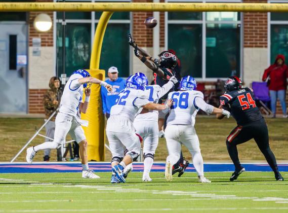 Barbers Hill quarterback Brady Barrier fires off a pass against the Port Arthur Memorial Titans on Saturday in playoff action. Photo by Chris Cody Article Image Alt Text