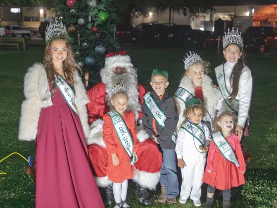 2025 Texas Gatorfest Queen Phoenix Garza (left), Little Queen Amelia Childress, Little King Asa Rutland, Princess Jaxyn Phillips (back, second right), Junior Queen Brooklynn Armentor, Mr. Tot Treyson Finnex (front, second right) and Miss Tot Blakelynn Kahla sit with Santa Claus after the 20th Annual Anahuac Christmas Parade. Photo by Chris Cody Article Image Alt Text