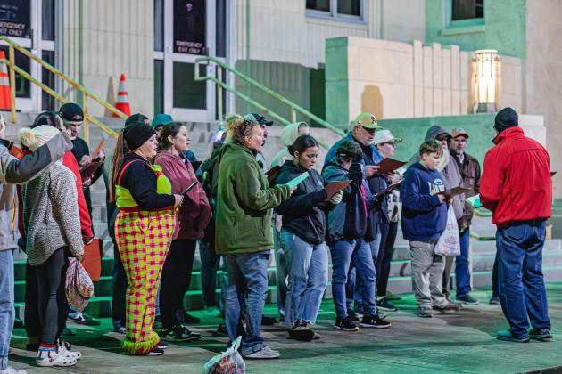 The Mid-Chambers County Ministerial Alliance welcomes the community to the 20th Annual Anahuac Christmas Parade, featuring Christmas carols. Photo by Chris Cody Article Image Alt Text