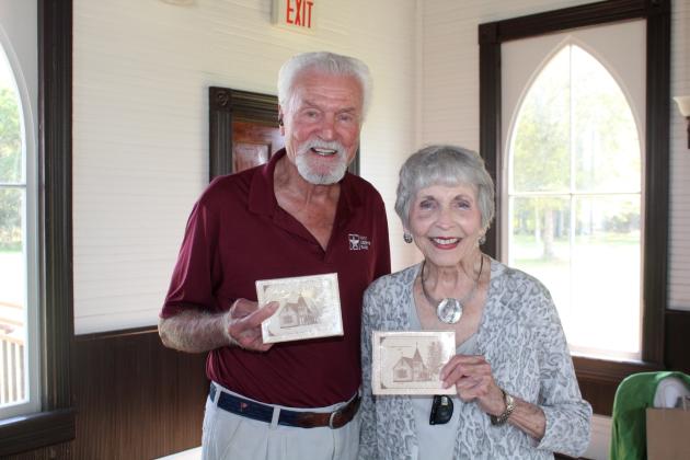 Charles Wiggins (left) and Sandra Sterling receive stationery featuring the original St. Stephen’s Episcopal Church, as they are the longest-term members of the church. Article Image Alt Text