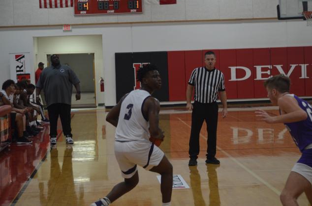 AJ Tompkins of Dayton looks for an open man on Saturday morning at the Huntington Tournament against Chireno. The Vindicator | Jerry Michalsky Article Image Alt Text