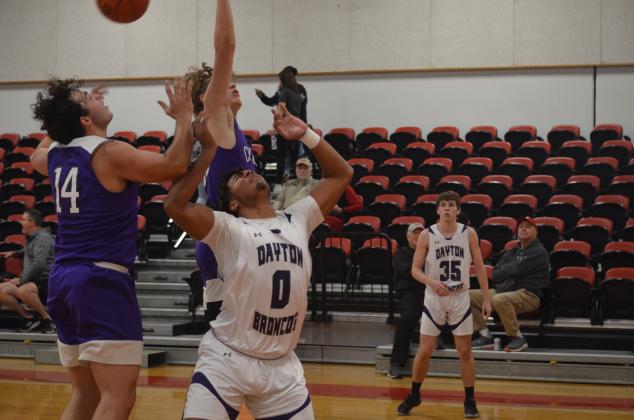 Camron Cooper of Dayton battles for rebounding position with a couple of Chireno players on Saturday morning at the Huntington Tournament. The Vindicator | Jerry Michalsky Article Image Alt Text