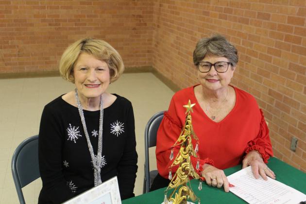 Caroline Wadzeck (left) and Cynthia Miller greet guests at the annual holiday gathering. The Vindicator | Geovanni De Hoyos Article Image Alt Text