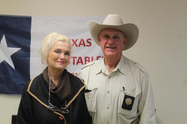 Dennis and Sarita Dugat celebrate Dugat's retirement from the Chambers County Constable's Office. They are both hoping to travel more. Article Image Alt Text