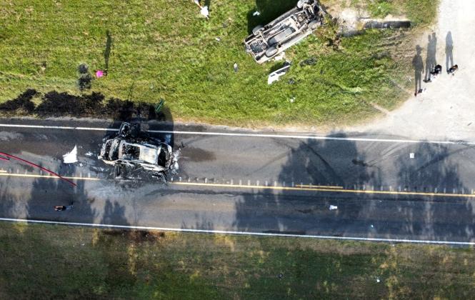 A vehicle caught fire after a collision on FM 1011. Bruce Reyes and Lindsey Delaney saved the life of the driver by pulling her out of the car. Article Image Alt Text