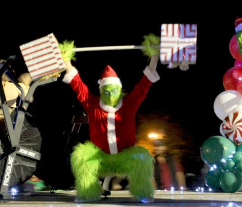 In Cleveland the Grinch put on a display of strength during the Hometown Christmas Parade. The Vindicator | Geovanni De Hoyos