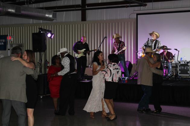 Attendees of the Legacy Gala join in dance, celebrating 75 years of the Bayside Community Hospital. Article Image Alt Text