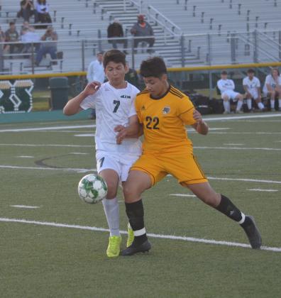 Liberty’s Jorge Rangel fights for the ball against this LC-M player on Friday night in Winnie. The Vindicator | Jerry Michalsky Article Image Alt Text