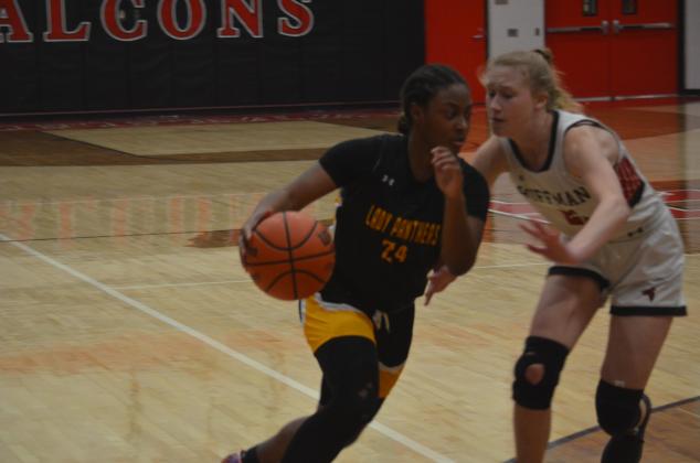 Hamshire- Fannett on Friday night. The Vindicator | Jerry Michalsky Tay Carry of Liberty drives to the bucket on Tuesday night at Huffman. Article Image Alt Text