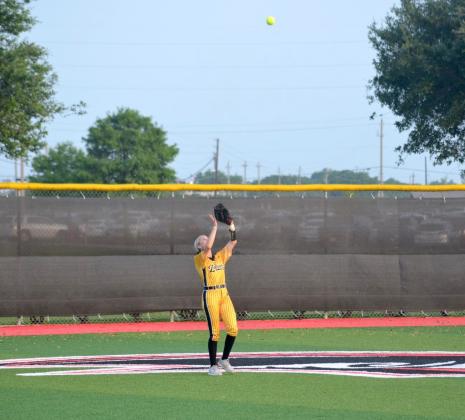 Liberty's Bailee Slack gets ready to make the catch in center field against Bridge City on Thursday night in Baytown. Article Image Alt Text