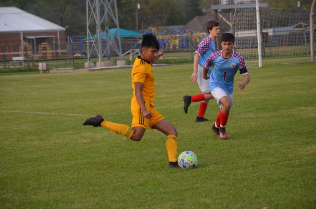 Jaime Lopez of Liberty centers this ball at Memorial Stadium on Friday night in Bi-district action against Lumberton. Article Image Alt Text