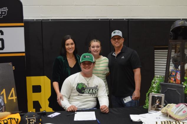 Gage Pavliska of Liberty with his family after signing to play college baseball at Dallas College-Brookhaven. The Vindicator | Jerry Michalsky Article Image Alt Text