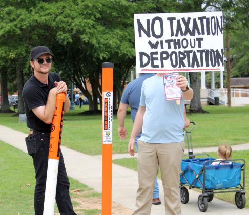 Protestors with a group called Real Texans for Justice hit the streets of downtown Liberty over the weekend in protest of Colony Ridge. The Vindicator | Russell Payne Article Image Alt Text