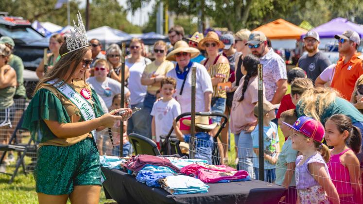 2024 Texas Gatorfest Queen Hannah Anderson handles a baby alligator at last year's event. This weekend will feature a slate of events, including the 2025 Texas Gatorfest Pageant. Article Image Alt Text