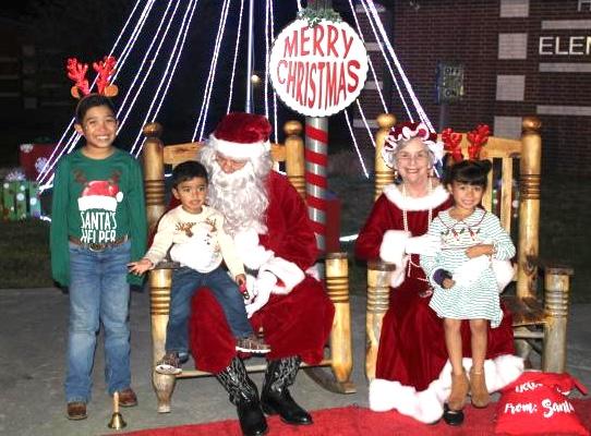 Santa and Mrs. Claus brightened children's day last year at the Hardin Helping Hands Christmas event. The event returns this Friday night at Hardin Elementary School. Article Image Alt Text
