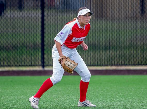 Anahuac's Jayda Granger is poised in left field last Wednesday night for the West Team in the SETCA All-Star Game. Article Image Alt Text