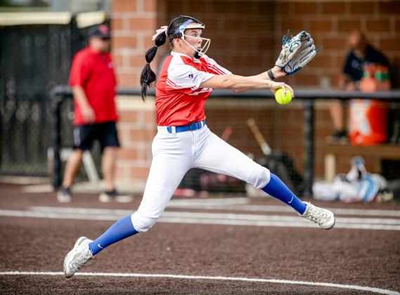Barbers Hill's Hailey Nutter fires a pitch to the plate as she leads the West in the SETCA All-Star Softball game last Wednesday in Anahuac. Article Image Alt Text
