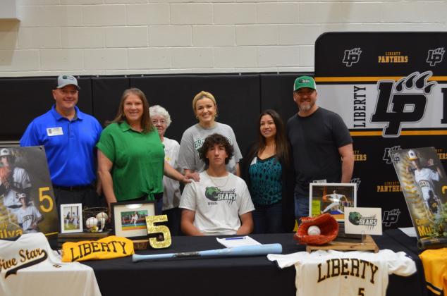 Liberty's Grady Silva and family after his signing with Dallas College- Brookhaven. Article Image Alt Text