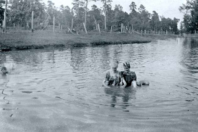 Contributed photo — Two girls swimming in "swim dresses" at Brookshire Pond, a culture spot in the 1920s near Lufkin, Texas. (Photo courtesy of Gay Roper Parker). Article Image Alt Text