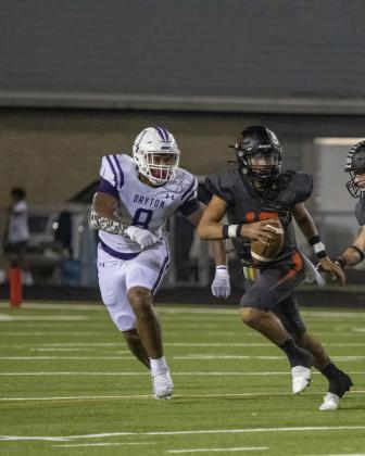 Camron Cooper closes in on the Texas City QB. The Vindicator | Amanda Jordan Article Image Alt Text