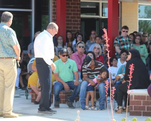 Cleveland Mayor Richard Boyett looks on as Wilson Garcia, whose wife and child were murdered with three other victims, embraces his daughter at a prayer vigil Sunday afternoon. Article Image Alt Text