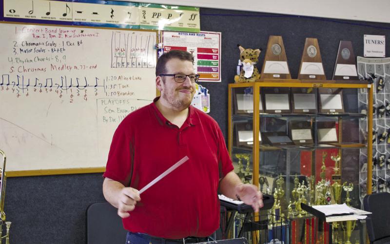 Mighty Bobcat Band Director Robert Underhill conducts the band during a rehearsal for the Christmas concert coming up on Monday. Photo by Celeste Denova