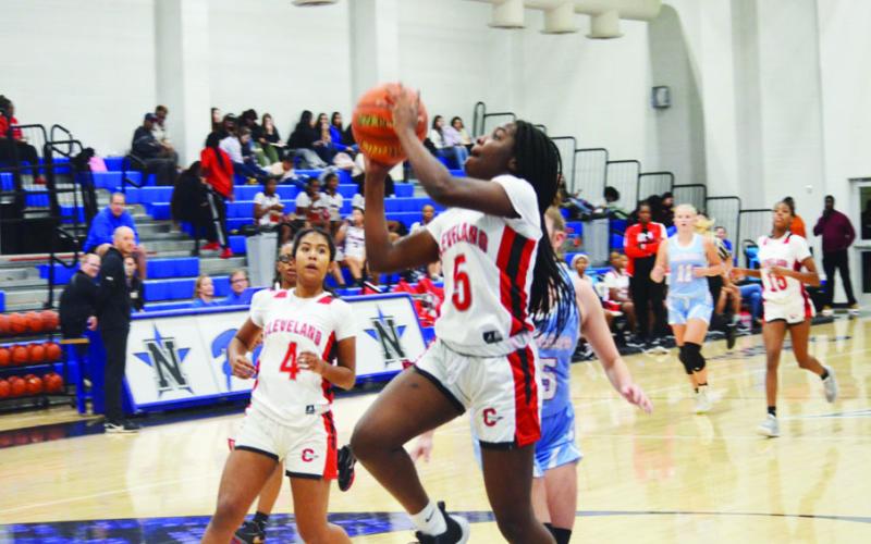 Kaniya Waller of Cleveland goes in for two points on Friday at the Navasota Tournament against Lumberton. The Vindicator | Jerry Michalsky