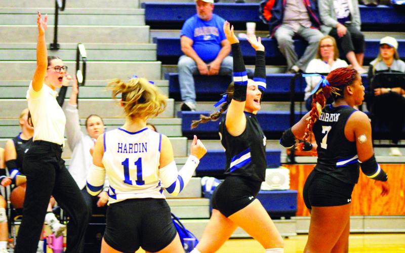 The Hardin Lady Hornets celebrate a big play against the East Bernard Lady Brahmas on Tuesday night in Tomball. The Lady Hornets clinched a huge Area Championship victory in four sets. Photo by Katie Fielder