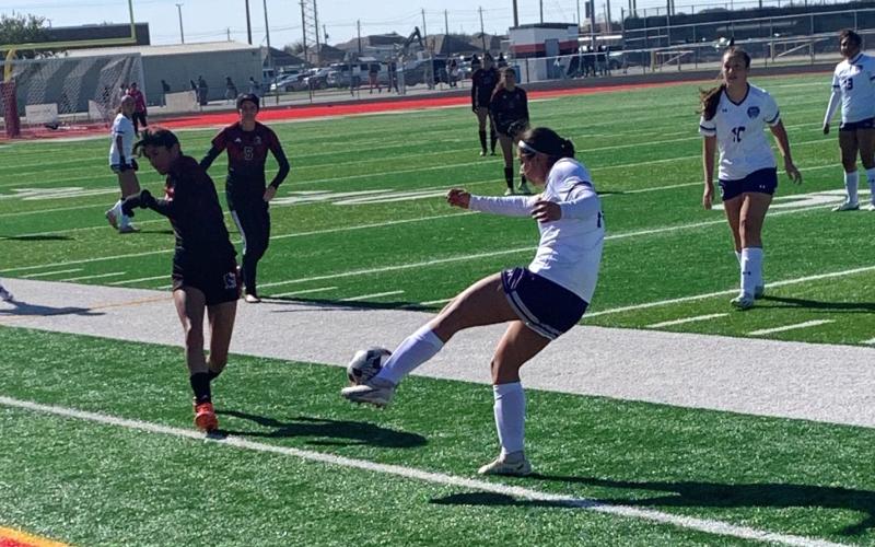 Mia Fuentes of Dayton puts her foot to the ball against Goose Creek Memorial on Friday afternoon in Baytown. The Vindicator | Jerry Michalsky 