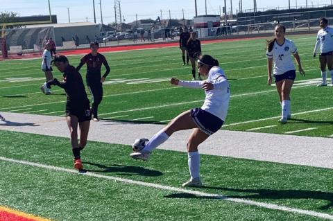 Mia Fuentes of Dayton puts her foot to the ball against Goose Creek Memorial on Friday afternoon in Baytown. The Vindicator | Jerry Michalsky 